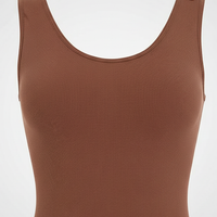 Slimming bodysuit, close-up fabric detail.