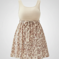 Plus-size knit floral sleeveless dress, casual elegant style, front view on model.