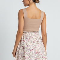 Plus-size floral knit sleeveless summer dress, chic style, front view on model.