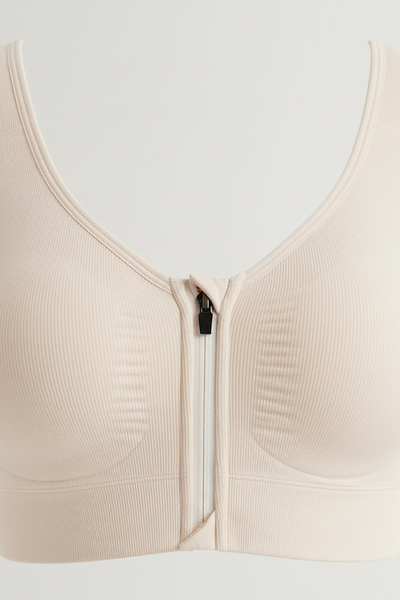 Sports bra front zipper fabric detail.