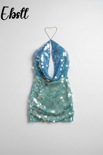 Two-tone sequin halter mini dress with cutout detail, on model.