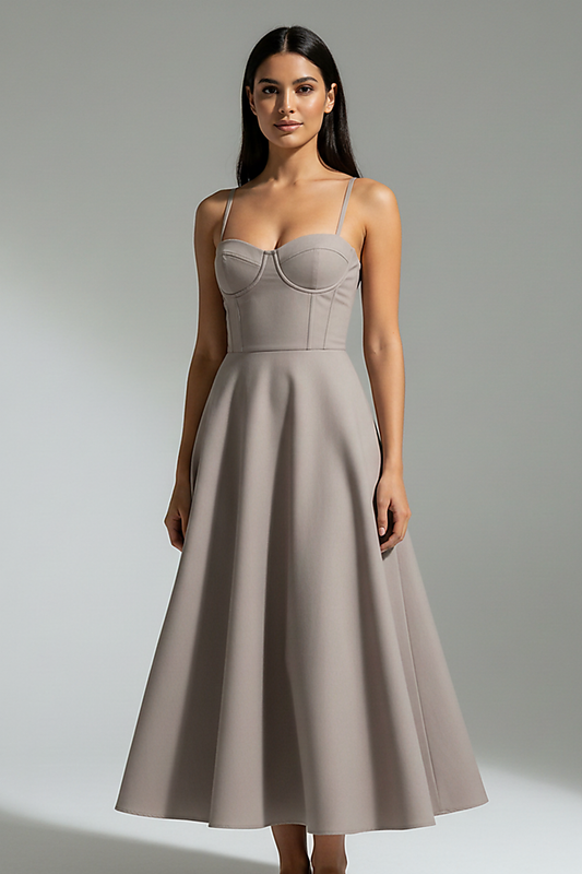 Navy midi dress, side view on model.