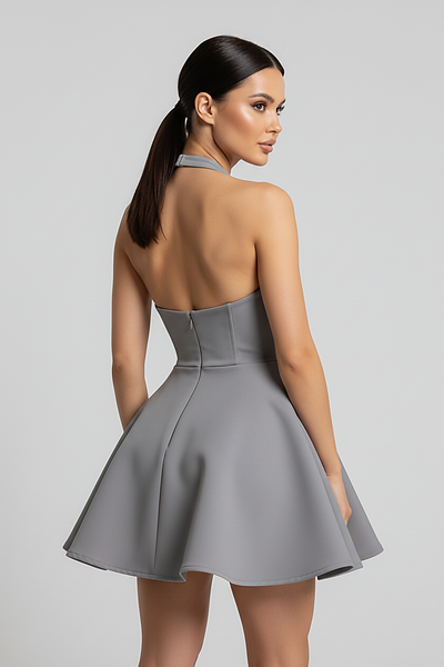 Backless halter pleated A-line mini dress, front view on model.