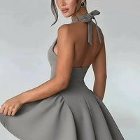 Halter backless waist wrap mini dress, front view on model.