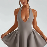 Halter V-neck backless pleated mini dress, front view on model.