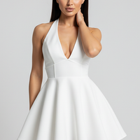 V-neck backless halter pleated mini dress, front view on model.