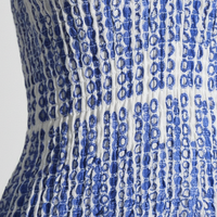 Black cut-out mini dress with layered hem, high-waist, front view on model.