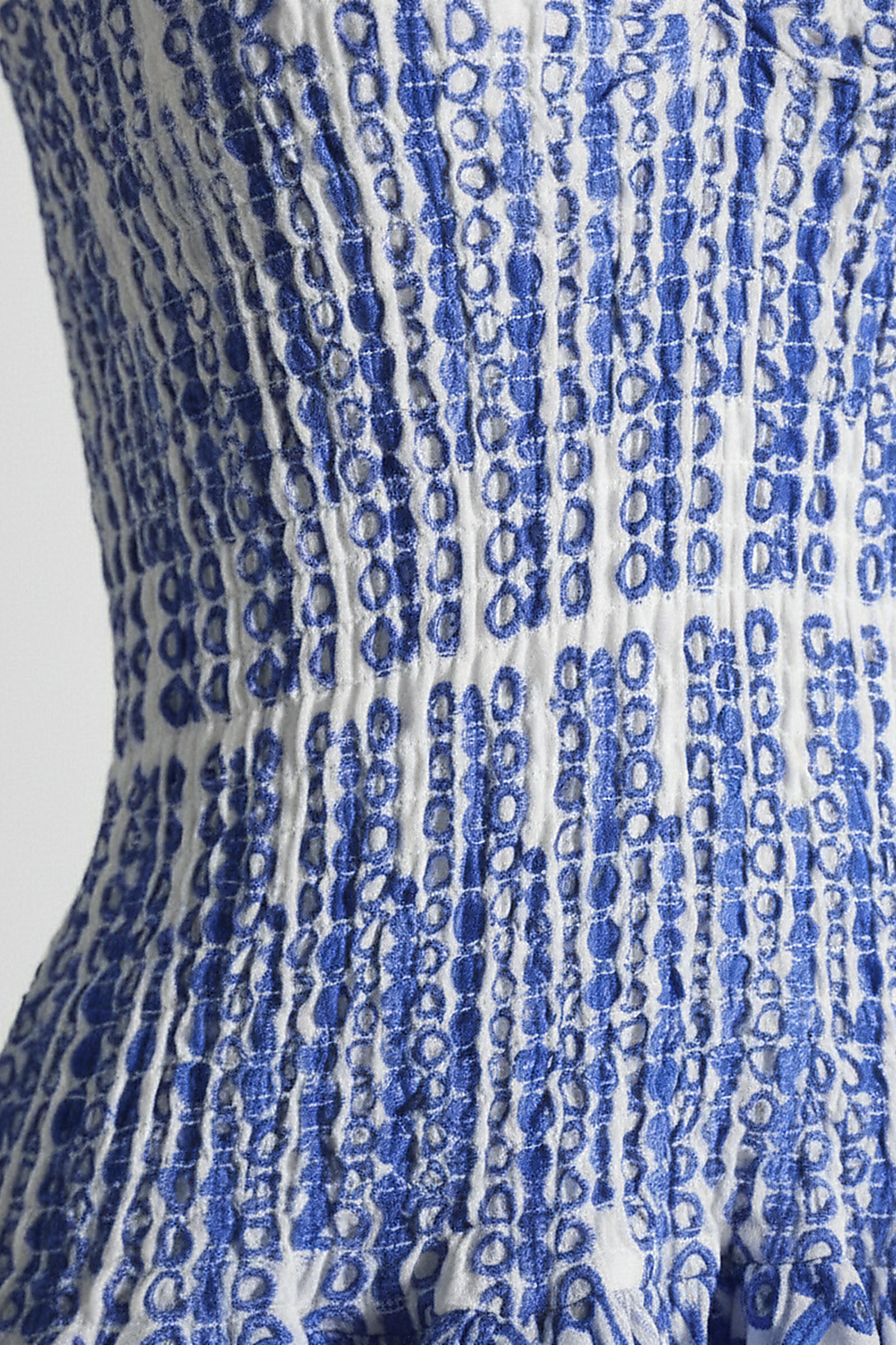 Black cut-out mini dress with layered hem, high-waist, front view on model.