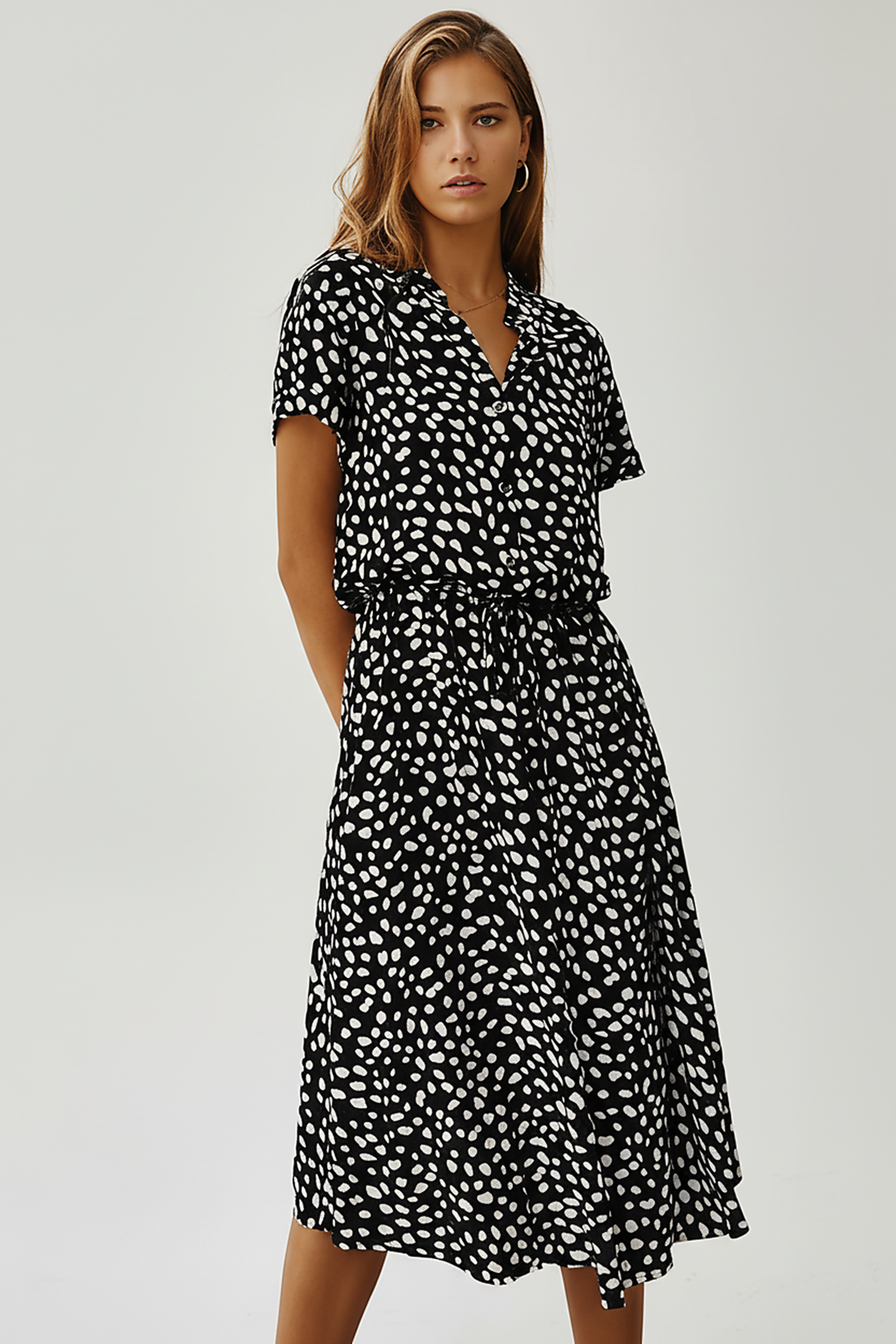 Vintage floral print dress, close-up detail.