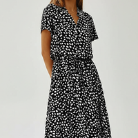 Vintage floral print dress, casual wear on model.