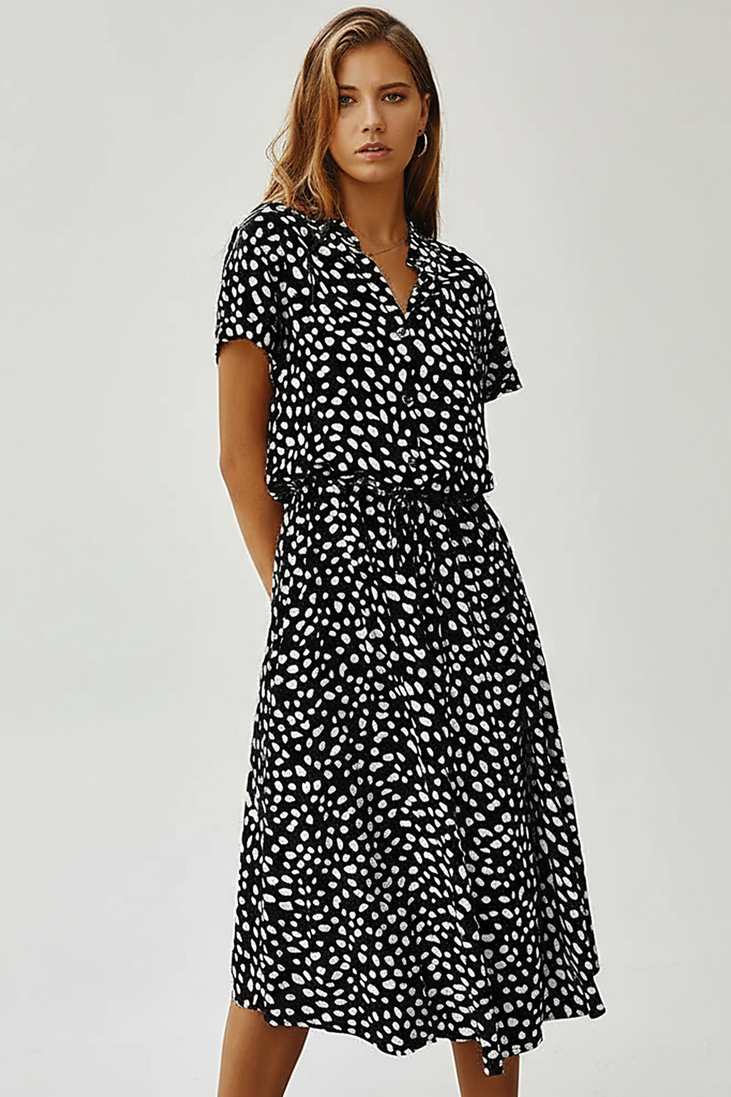 Vintage floral print dress, casual wear on model.