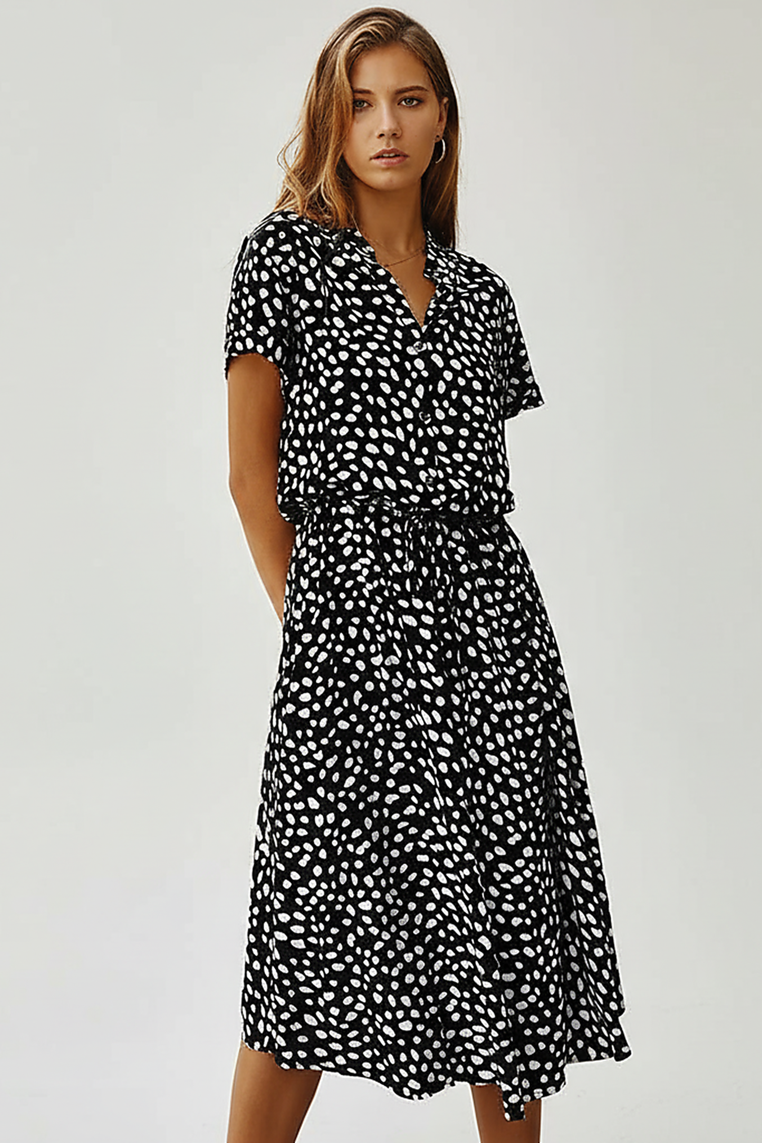 Vintage floral print dress, casual wear on model.