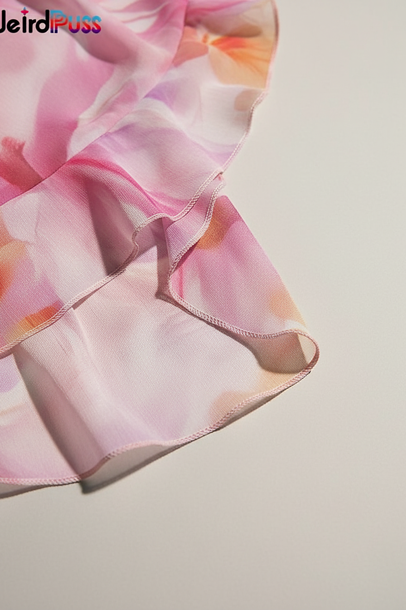 Floral print strapless bandage dress with irregular tassel patchwork, front view on model.