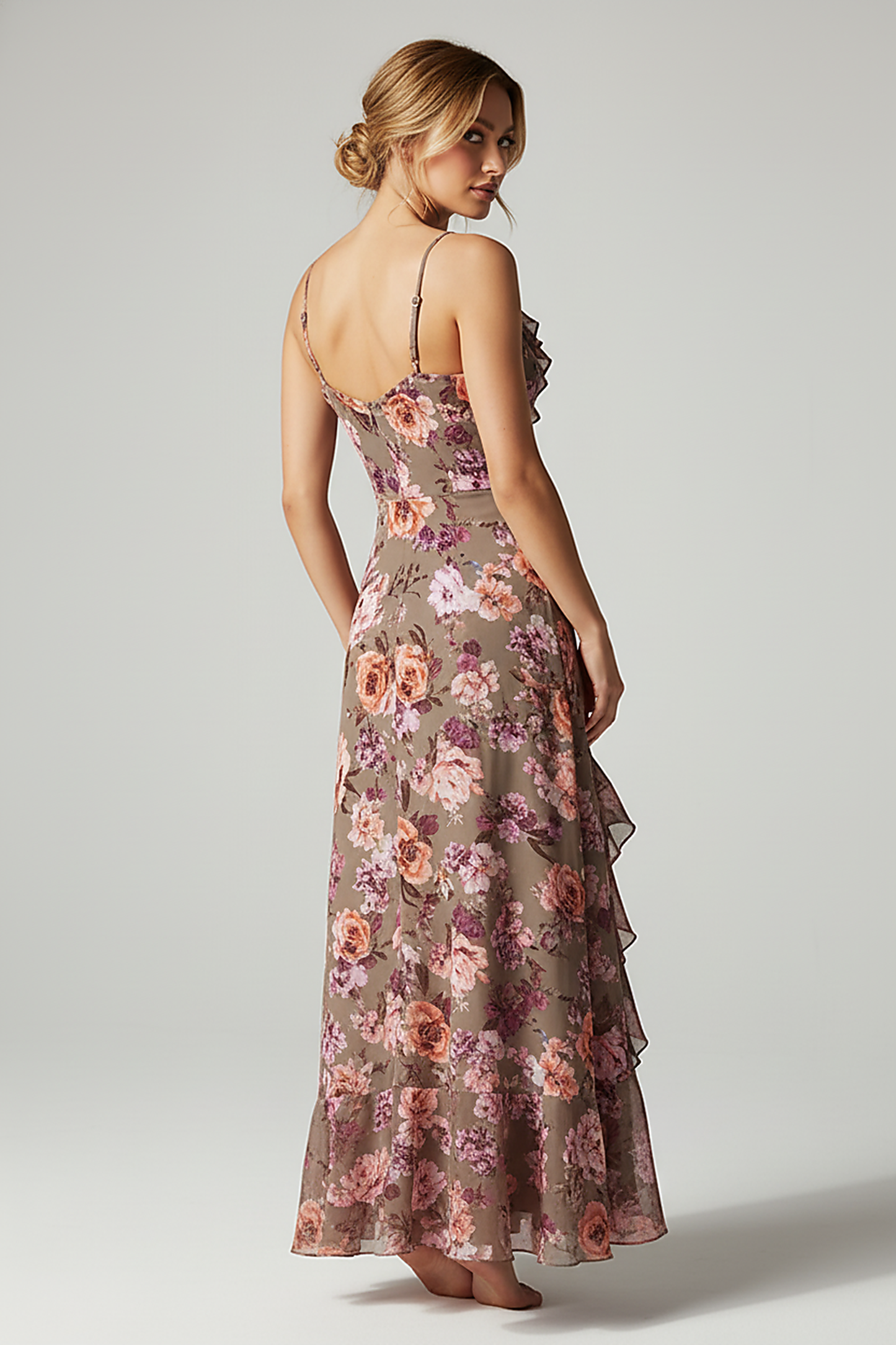 Floral print bandage dress with patchwork tassel and irregular hem, front view.