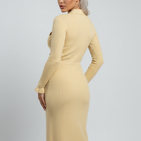 Cozy long-sleeve ruffle sweater dress, indoor lifestyle view on model.