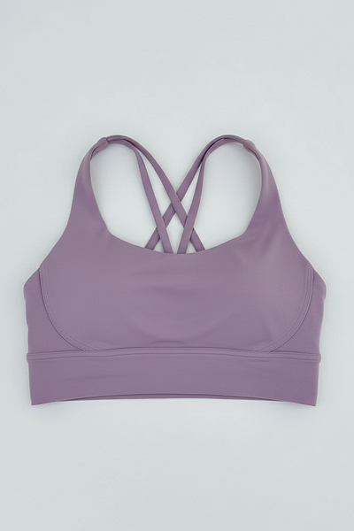Women's breathable cross-back sports bra, alternate angle on model.