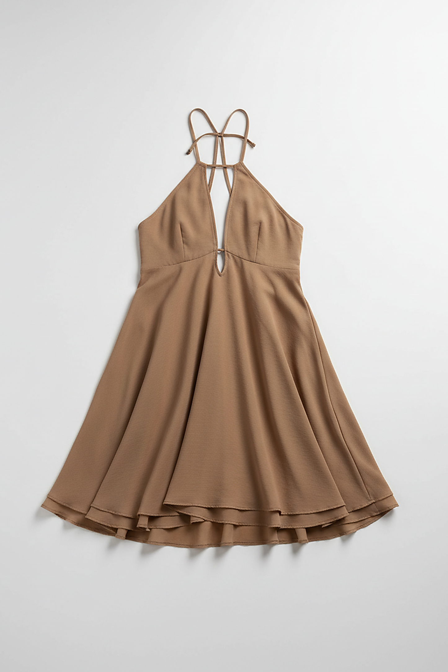 Halter ruffle mini dress with off-shoulder detail and backless design, on model.