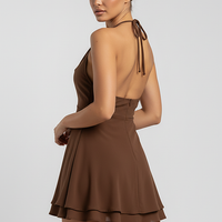 Layered ruffle A-line mini dress with halter neck, on model.