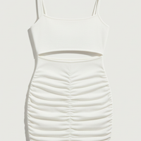 White spaghetti strap backless mini dress, evening style, on model.