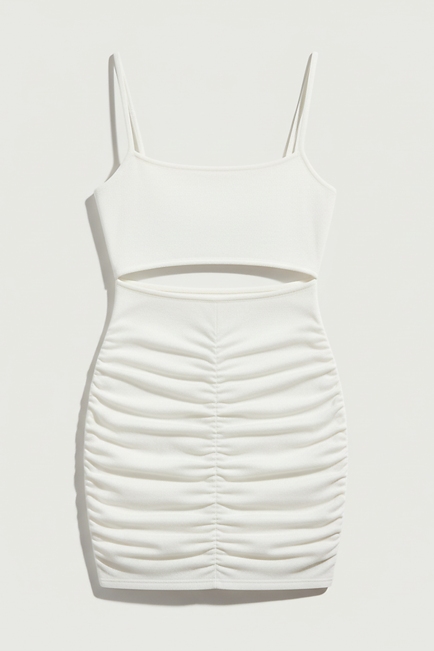White spaghetti strap backless mini dress, evening style, on model.