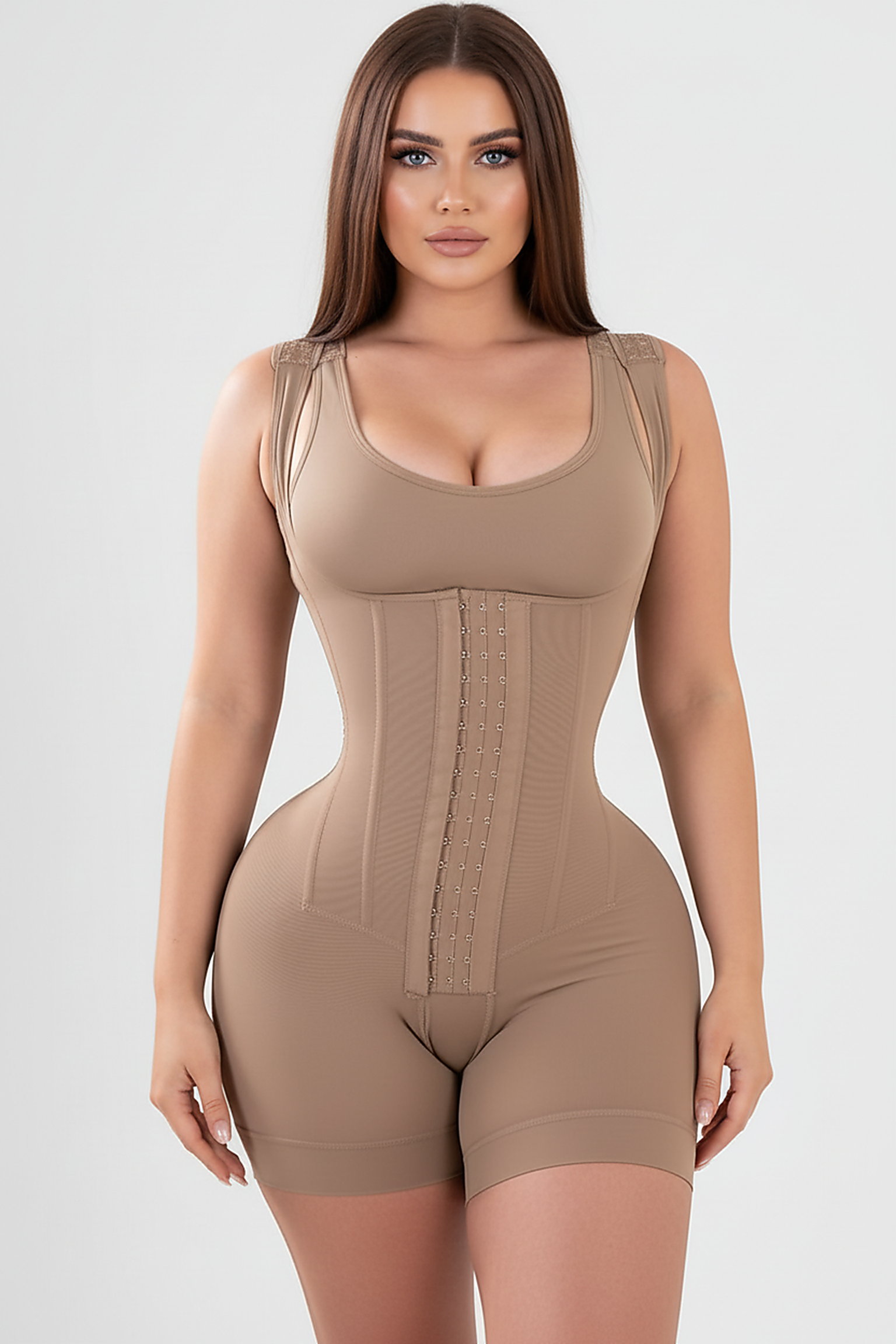 Black tummy control body sculpting faja, 3/4 view on model.