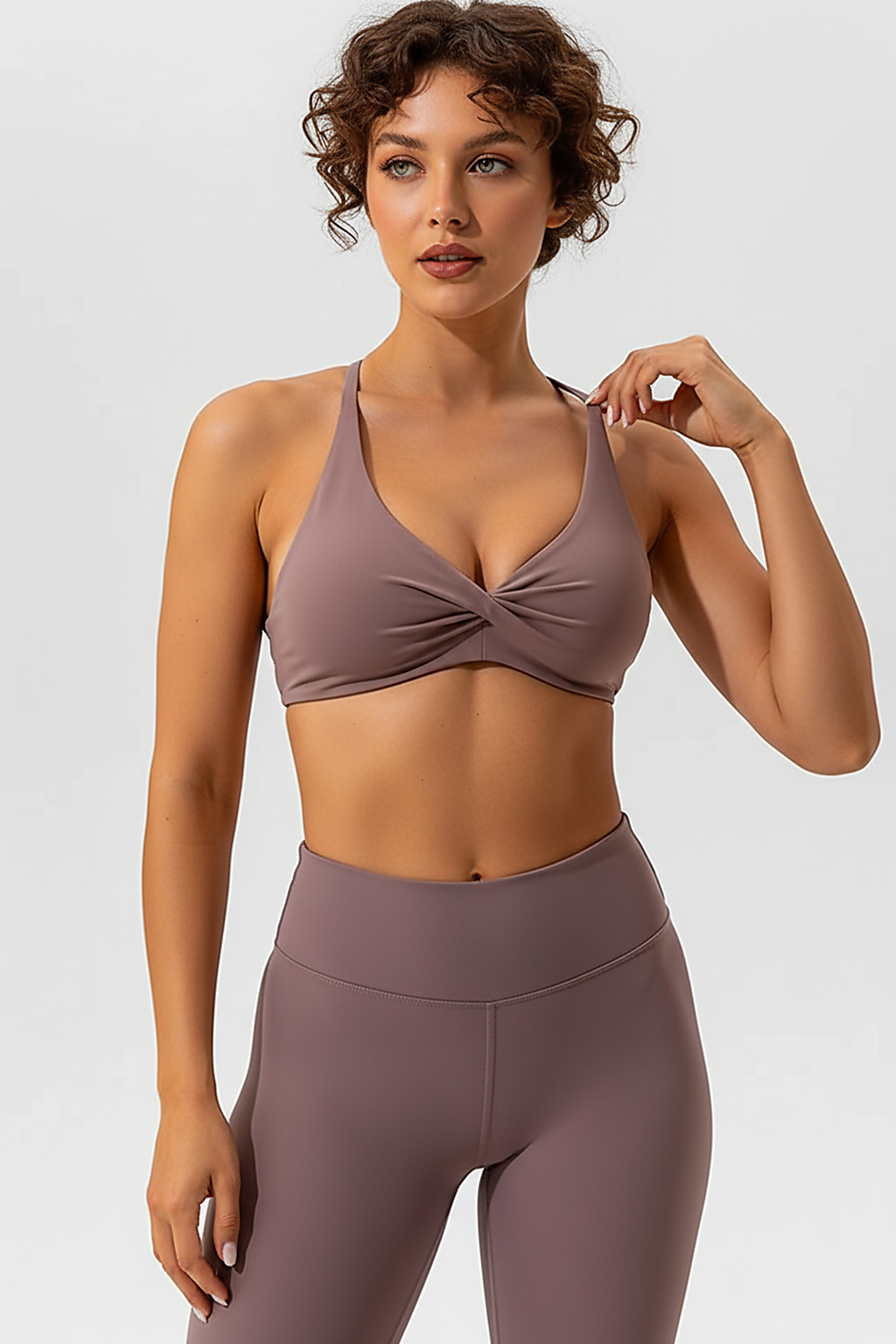 Sports bra with crease and cross back, back view.