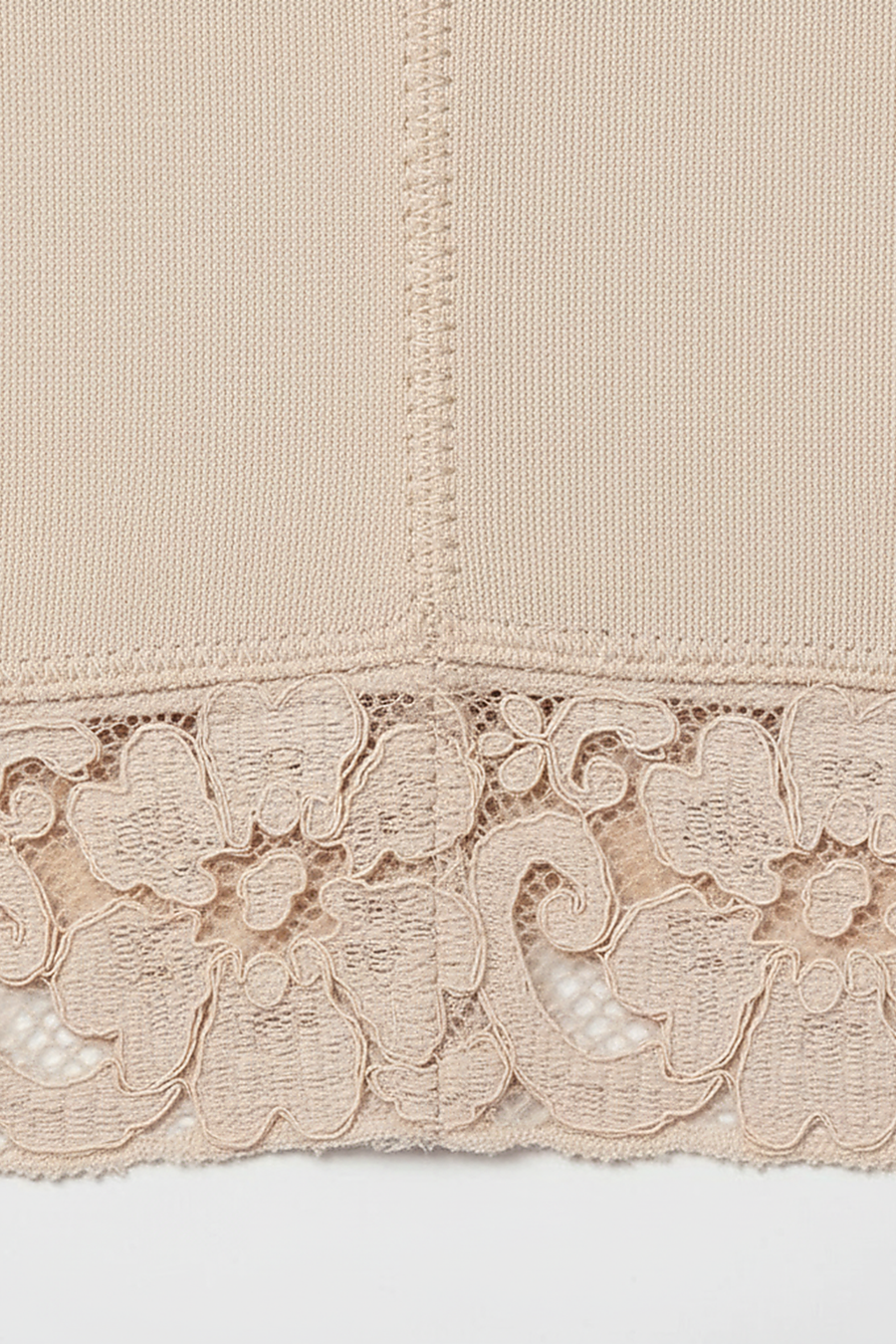 Women's postpartum high slimming girdle, angled view on model.