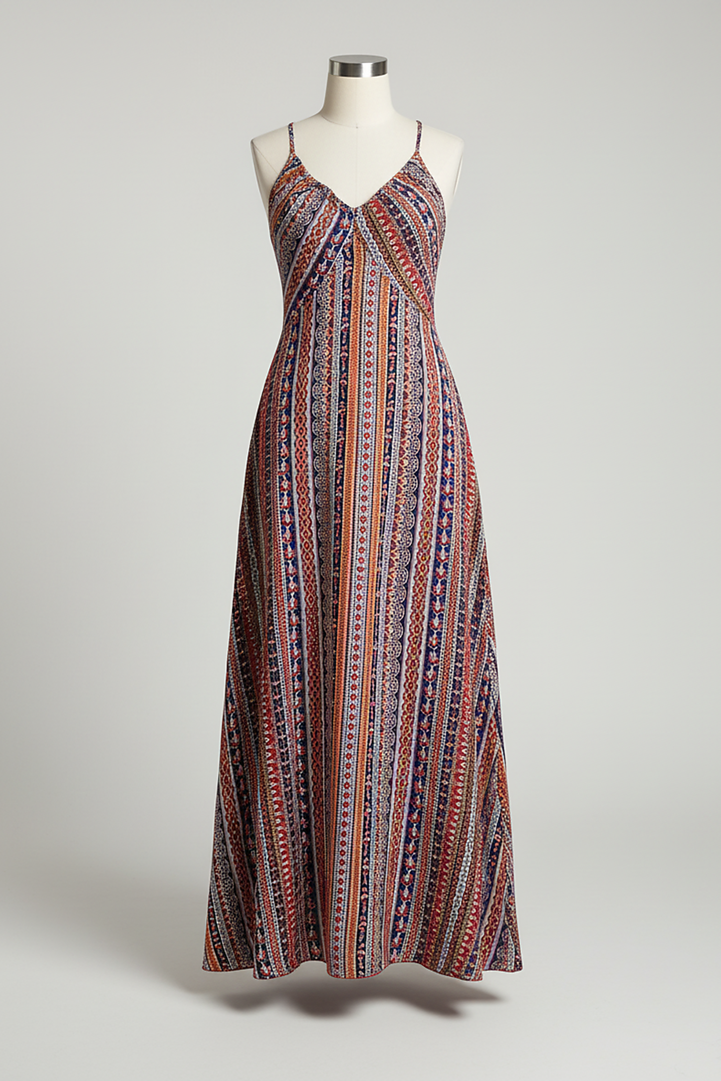 Flowy bohemian ethnic print maxi dress with frill trim, outdoor lifestyle.