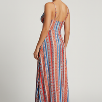 Printed bohemian resort dress with ruffle detail, outdoor lifestyle.