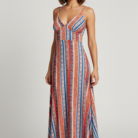 Ethnic bohemian maxi dress with split thigh and ruffle detail, front view.
