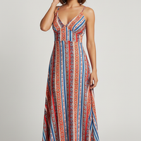 Ethnic boho vacation dress with frill trim, outdoor lifestyle.