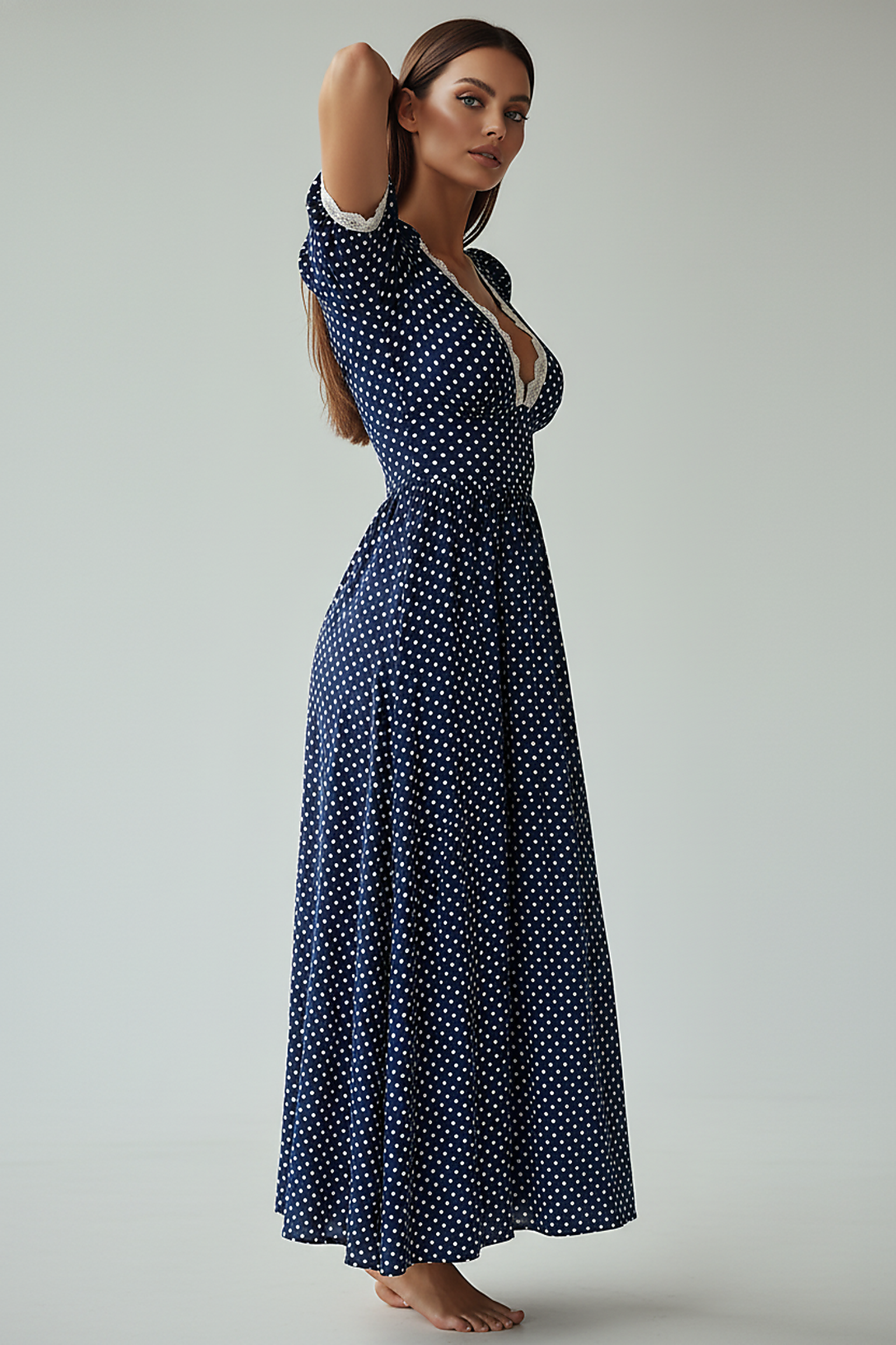 Elegant navy polka dot A-line maxi dress, V-neck, lace trim.