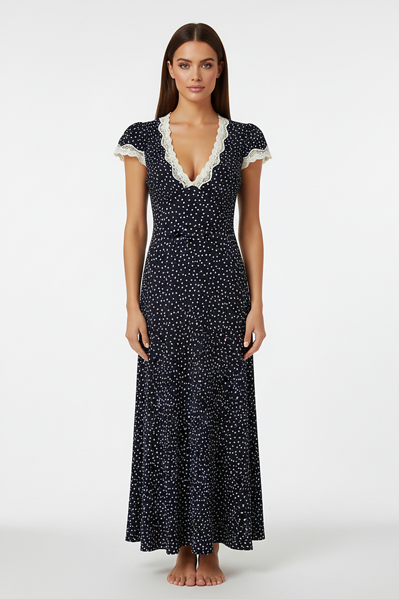 Flowy navy polka dot maxi dress with V-neck and lace trim, front view.