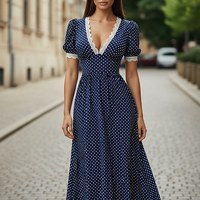 Navy blue polka dot maxi robe with V-neck and lace trim.