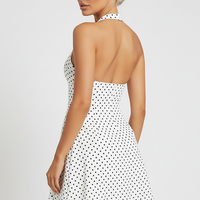 Slim A-line polka dot halter deep V mini dress, front view on model.