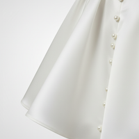 White short-sleeve mini dress, waist detail.