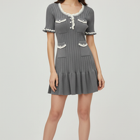 Knitted mini dress, front view on model.