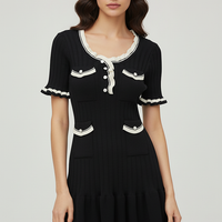 Knitted mini dress, side view on model.