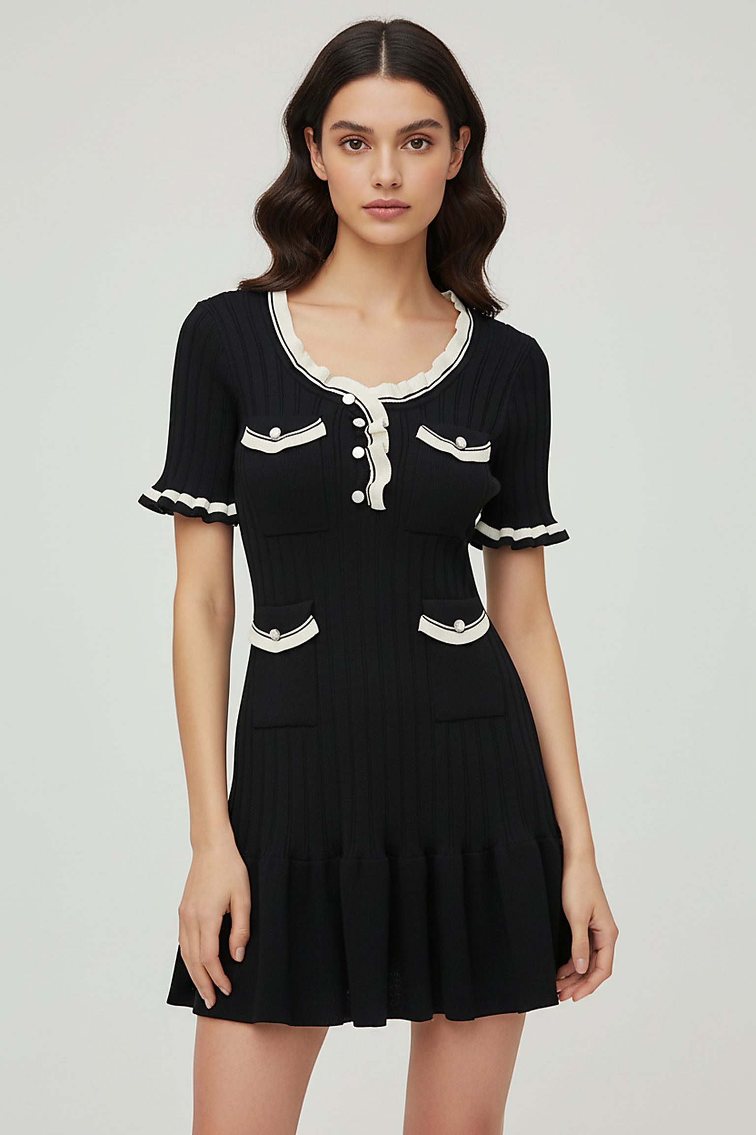 Knitted mini dress, side view on model.