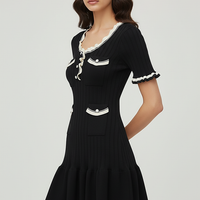 Knitted mini dress, back view on model.