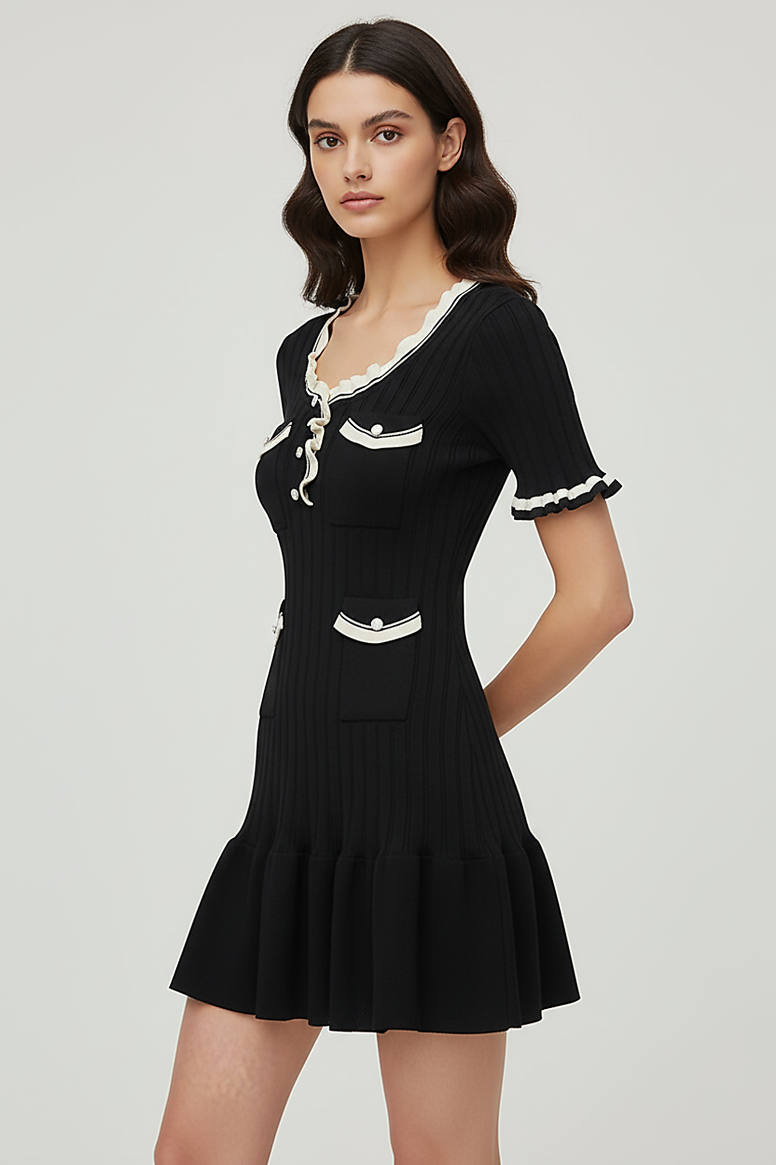 Knitted mini dress, back view on model.