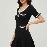 Knitted mini dress, front view on model.