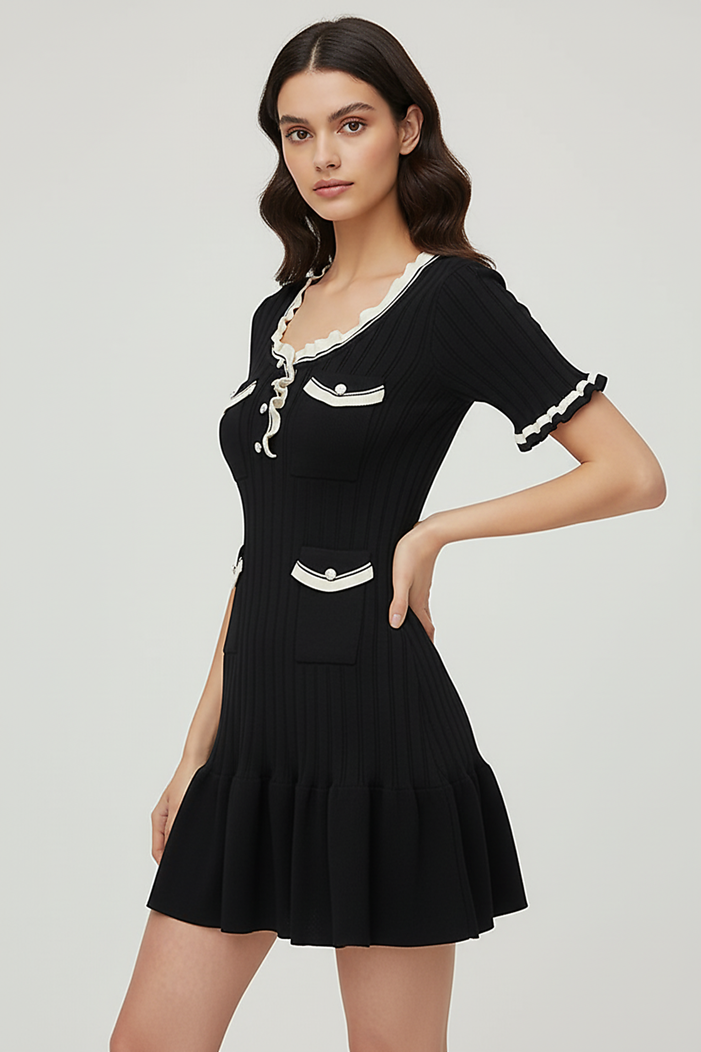 Knitted mini dress, front view on model.