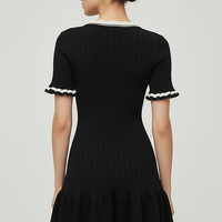 Knitted mini dress, fabric detail.