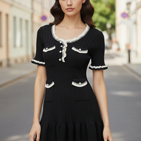 Knitted mini dress, side view on model.