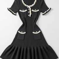 Knitted mini dress, front view on model.