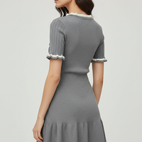 Knitted mini dress, model wearing dress.