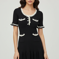 Knitted mini dress, front view on model.