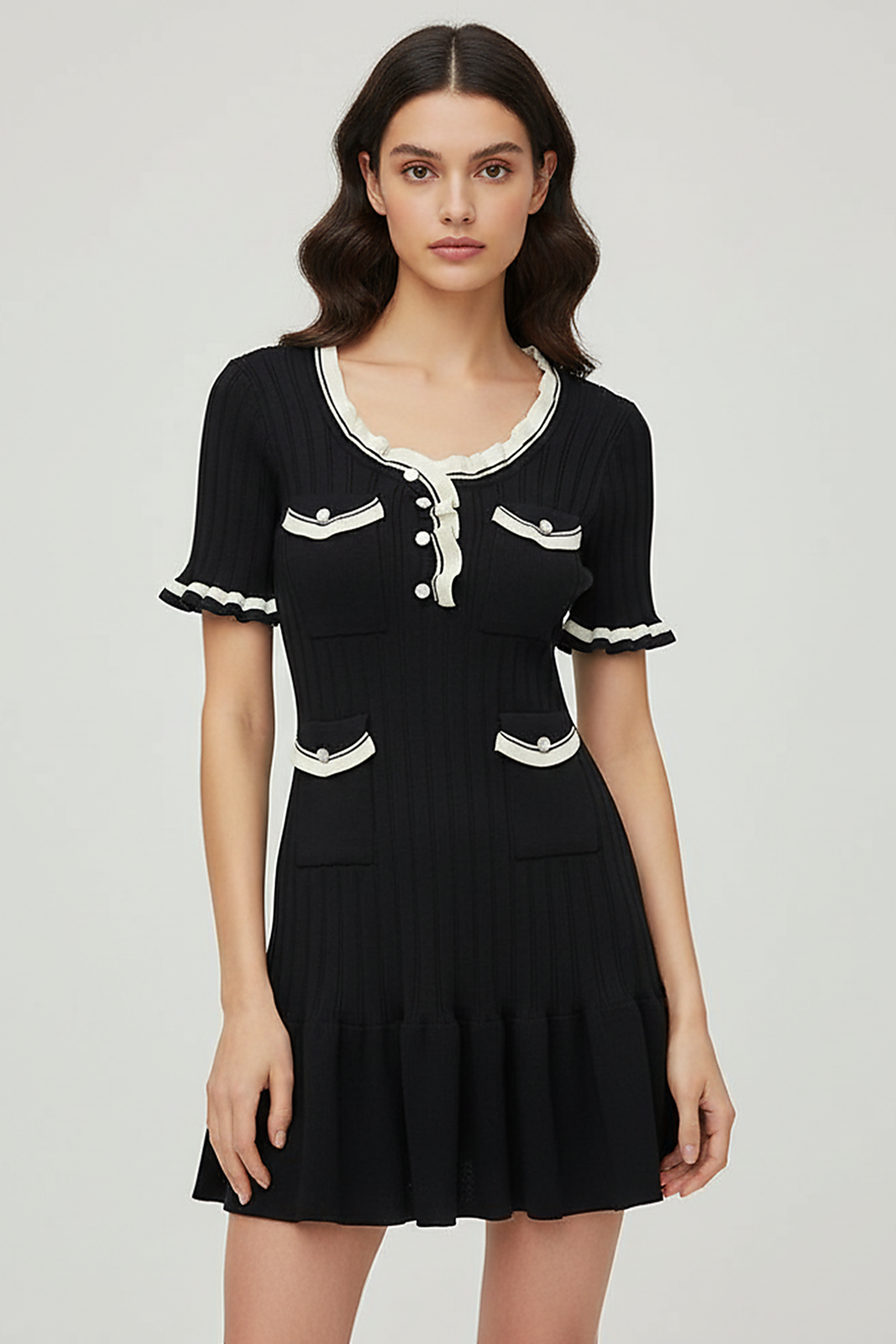 Knitted mini dress, front view on model.